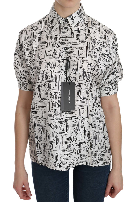 Top de seda con cuello y estampado de instrumentos musicales
