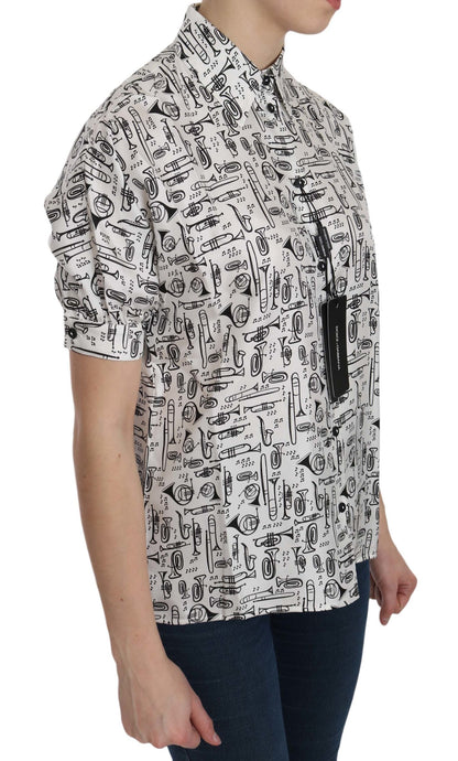 Top de seda con cuello y estampado de instrumentos musicales