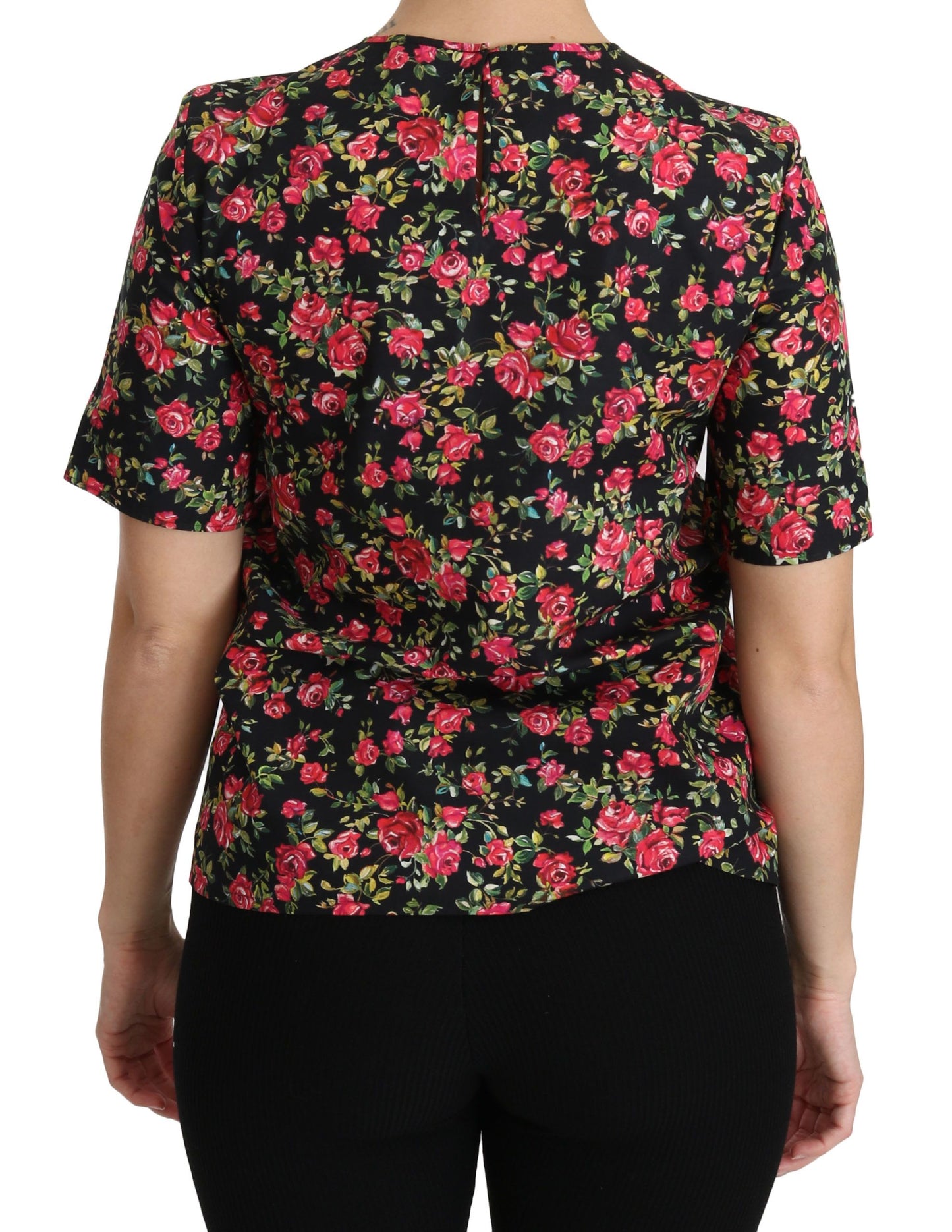 Elegante top negro con cuello redondo y estampado floral