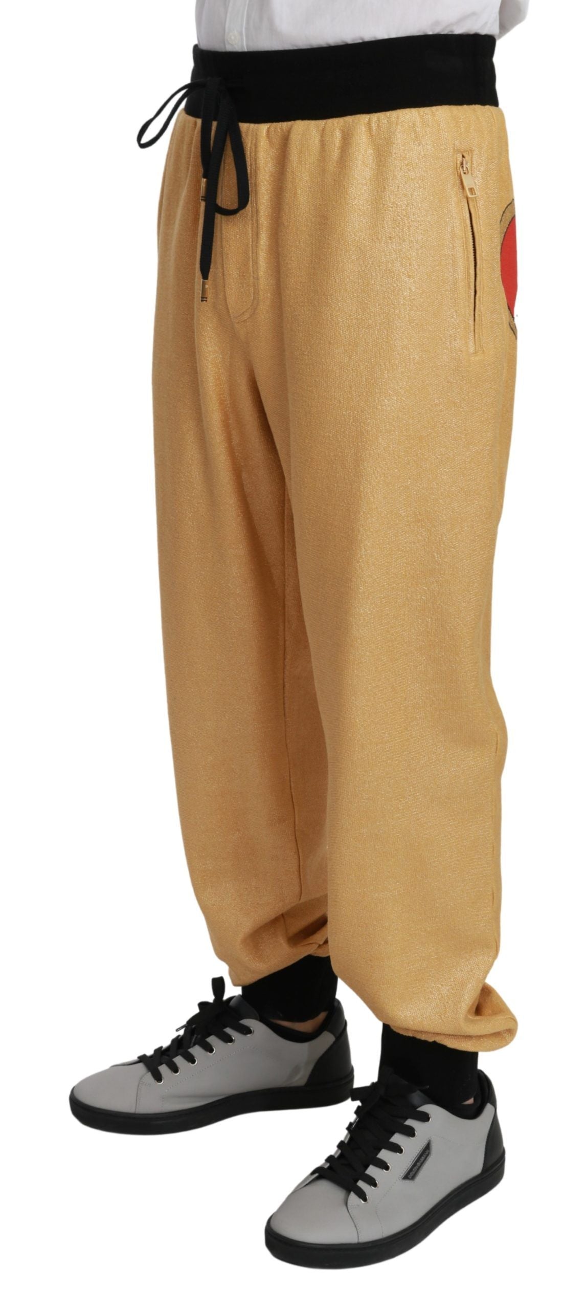 Elegantes pantalones deportivos con motivo dorado