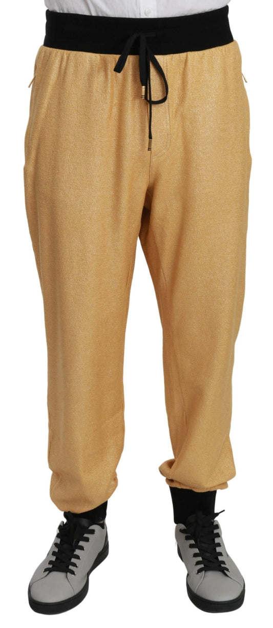 Elegantes pantalones deportivos con motivo dorado