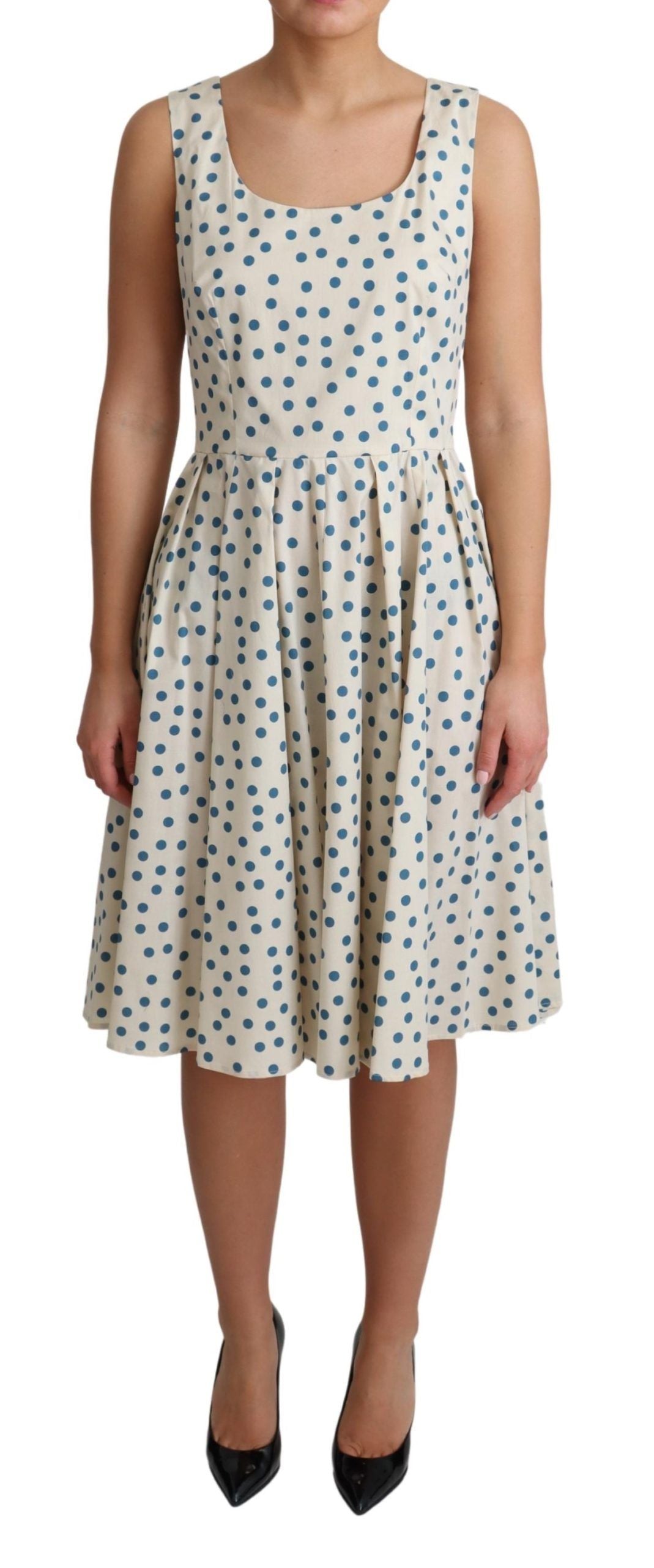 Elegante vestido beige de lunares sin mangas en forma de A