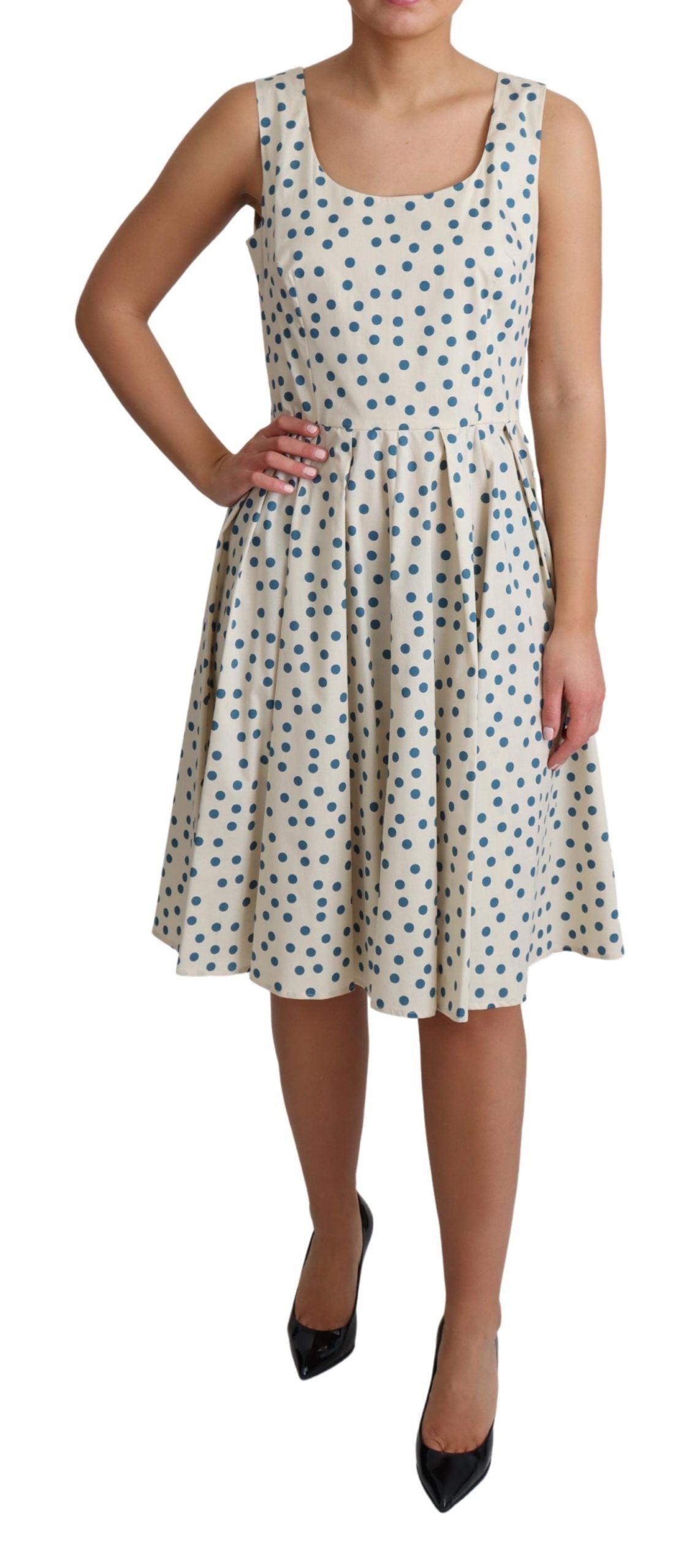Elegante vestido beige de lunares sin mangas en forma de A