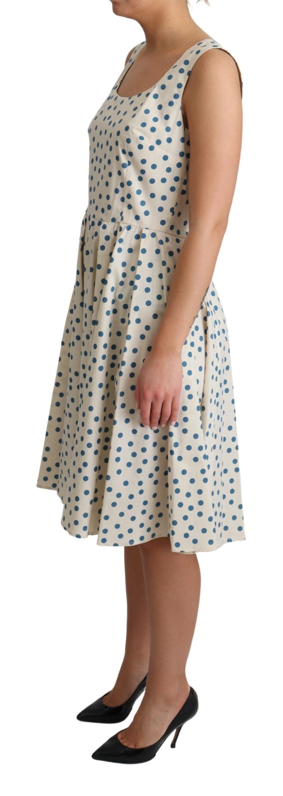 Elegante vestido beige de lunares sin mangas en forma de A