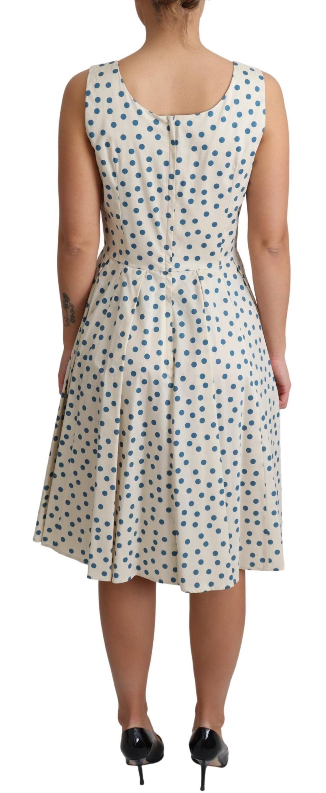 Elegante vestido beige de lunares sin mangas en forma de A