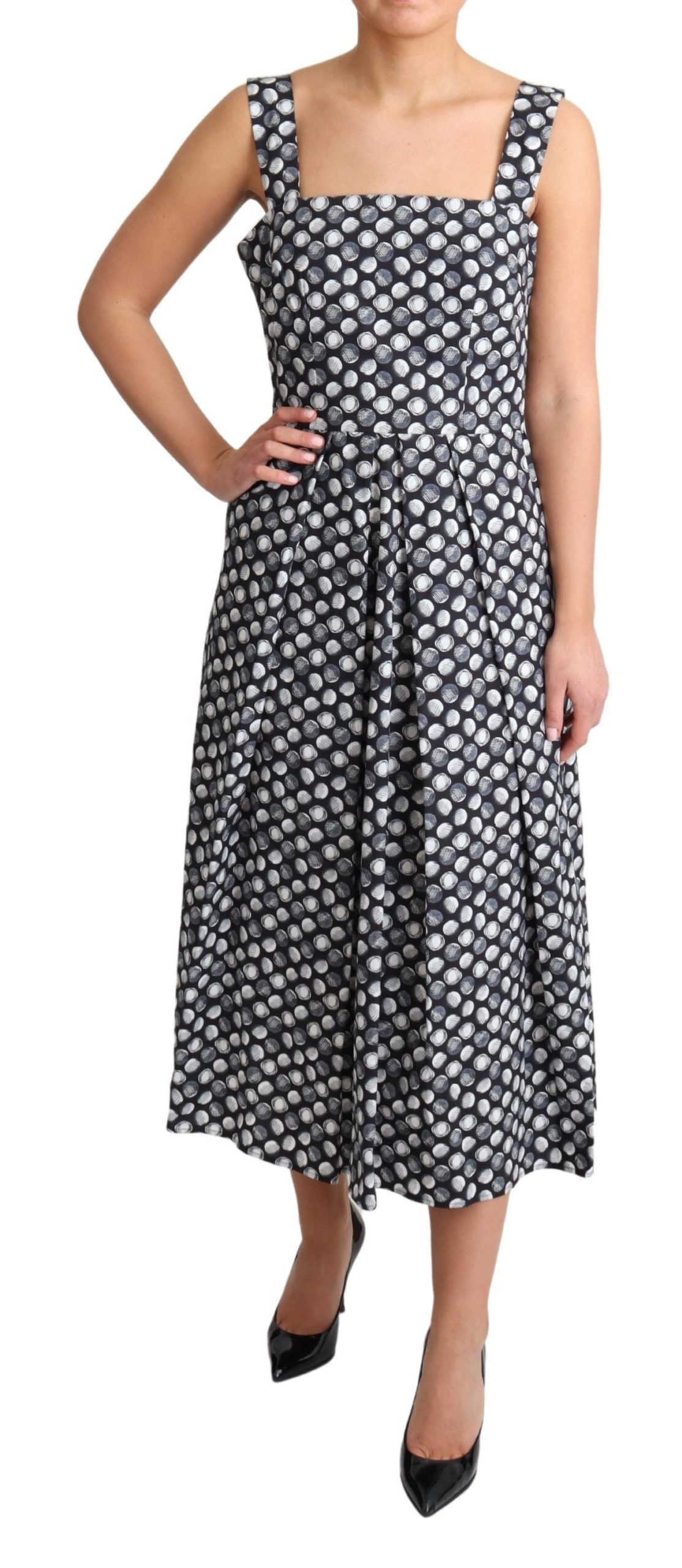 Elegante vestido midi geométrico sin mangas de corte A