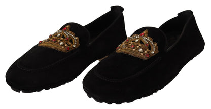 Elegantes mocasines de piel negra con bordado dorado