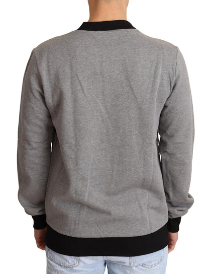 Suéter elegante de cuello redondo con motivo de corona gris