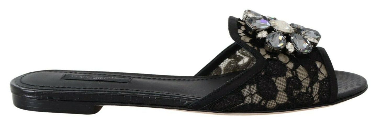 Elegantes mules de encaje negro con detalle de flor joya