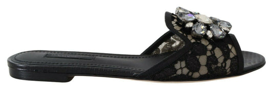 Elegantes mules de encaje negro con detalle de flor joya