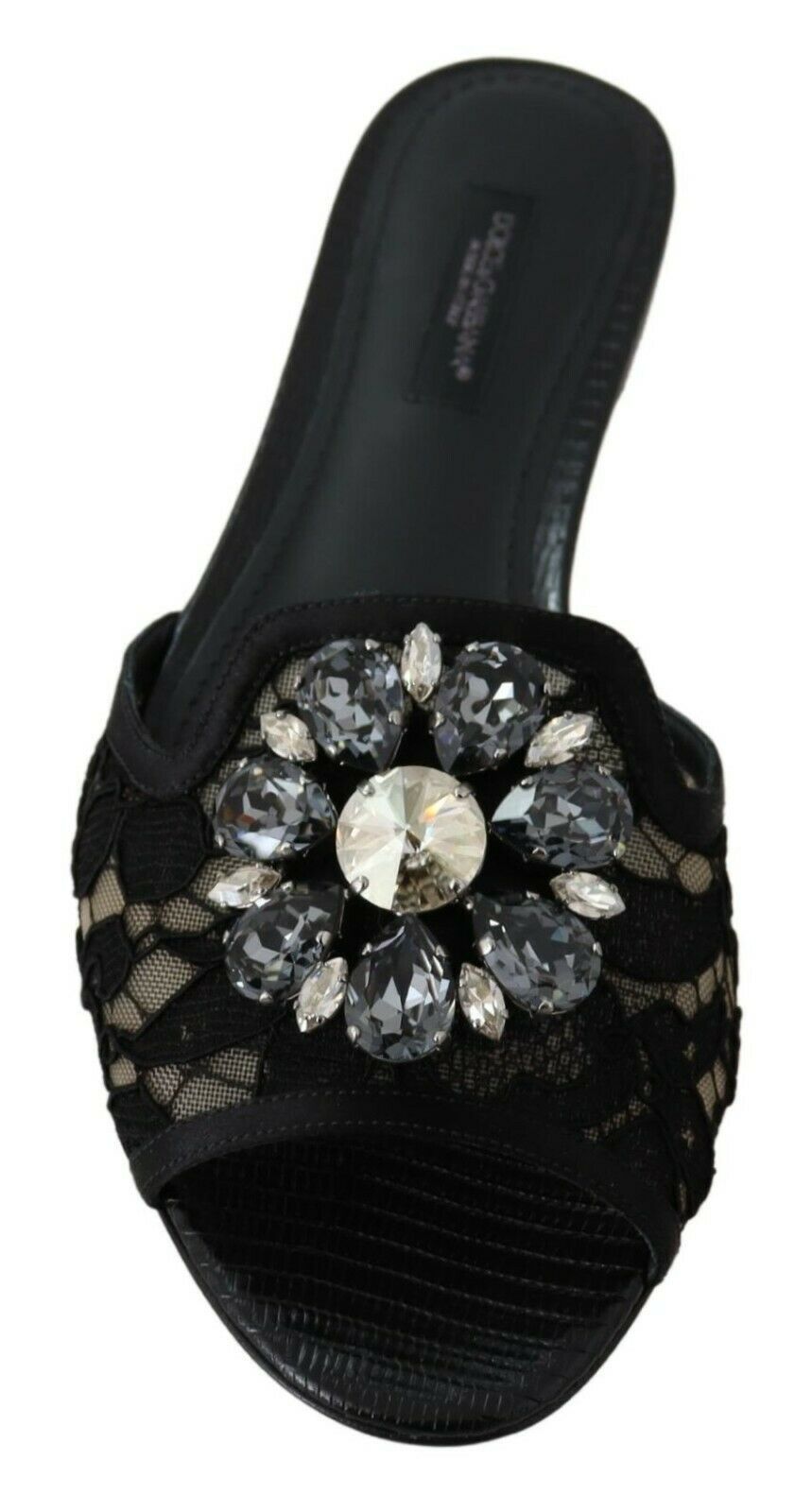 Elegantes mules de encaje negro con detalle de flor joya