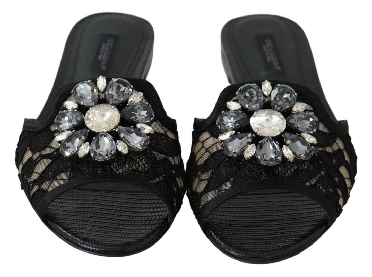 Elegantes mules de encaje negro con detalle de flor joya