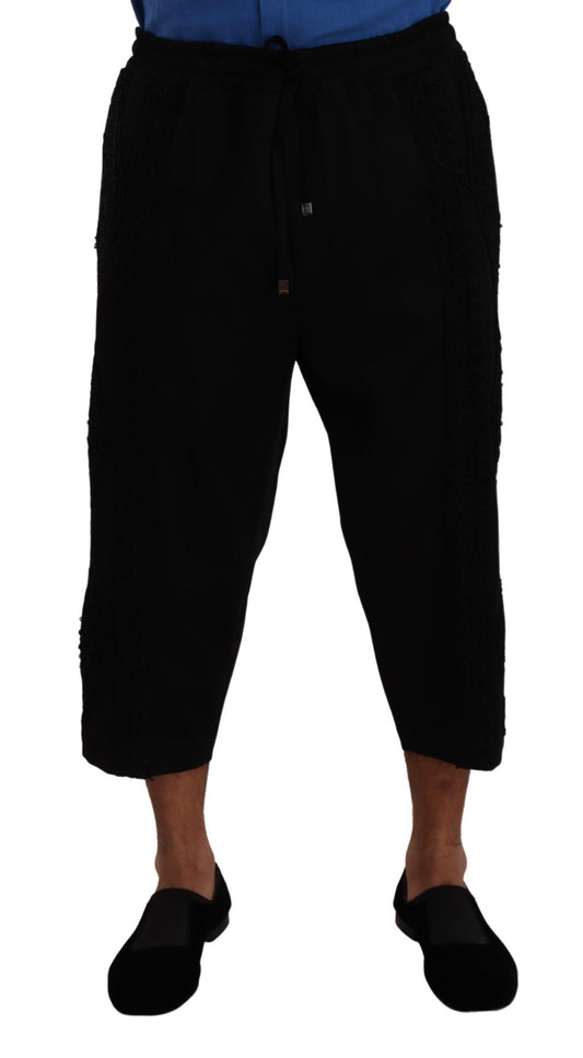 Elegantes pantalones negros de torero recortados