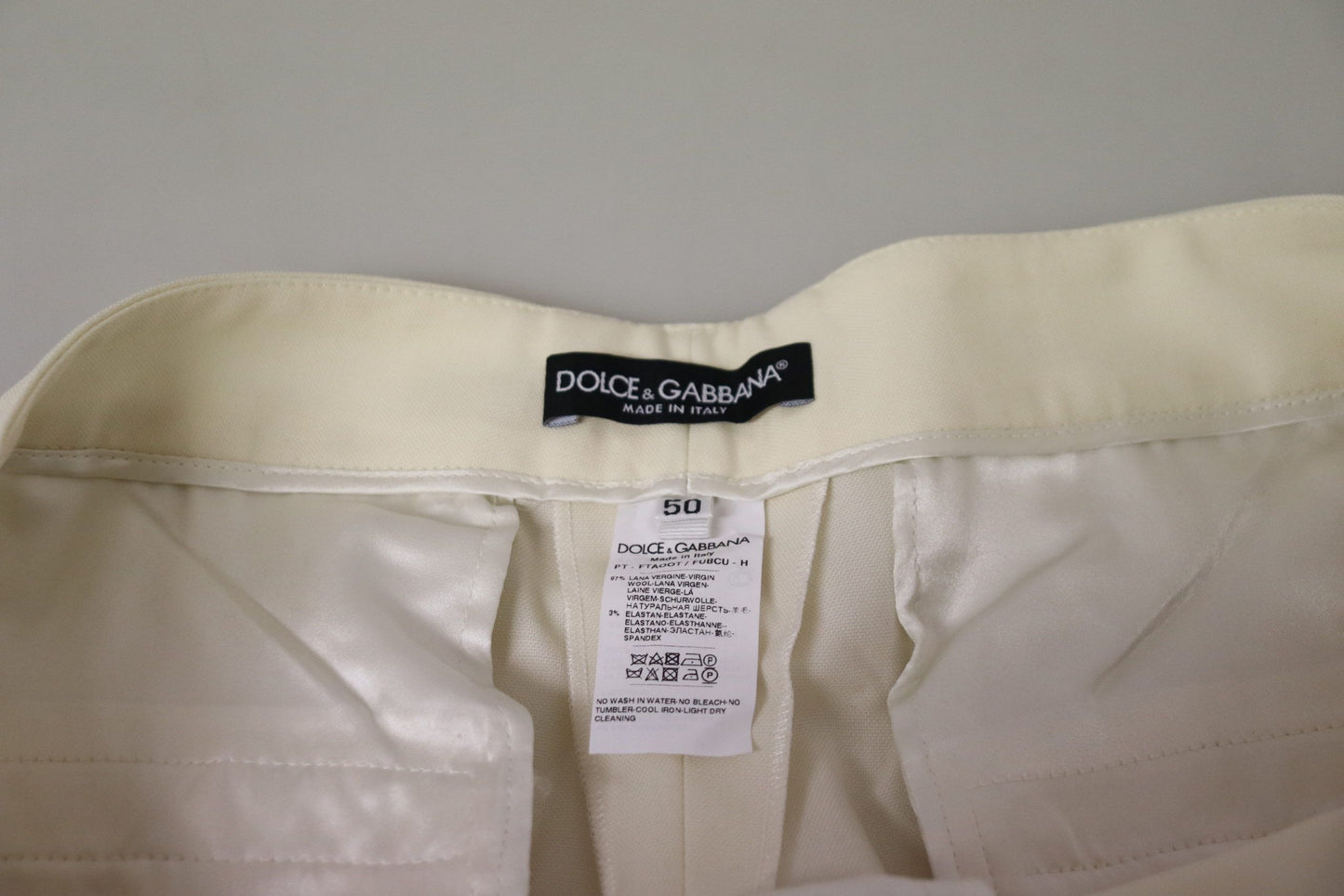 Elegantes pantalones de lana color marfil de cintura alta