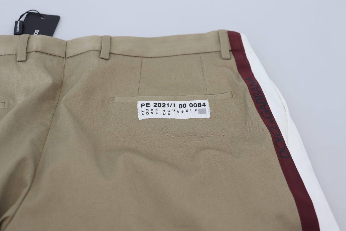 Pantalones elegantes de algodón en dos tonos blanco y marrón