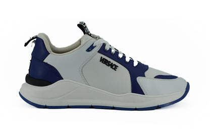 Elegantes zapatillas de piel azul y blanca