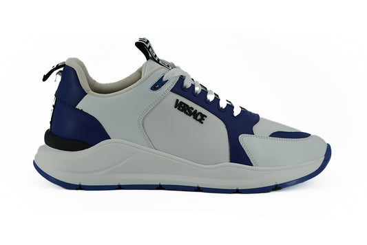 Elegantes zapatillas de piel azul y blanca