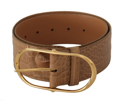 Elegante cinturón de piel beige con hebilla grabada