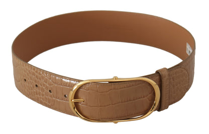 Elegante cinturón de piel beige con hebilla grabada