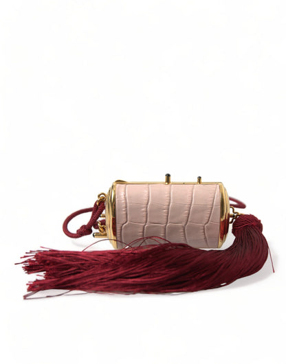 Mini bolso de espejo de cuero rosa exótico con borla