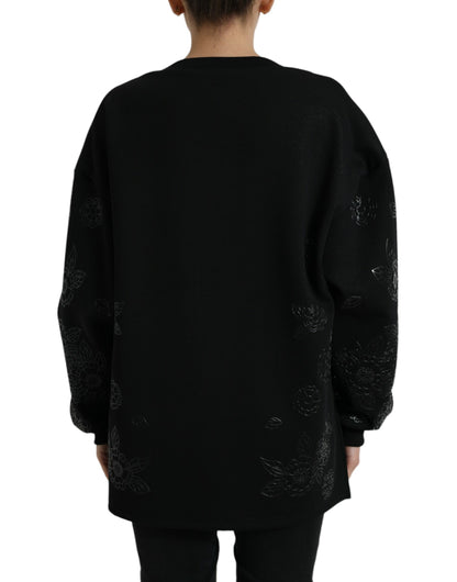 Elegante suéter negro con apliques florales