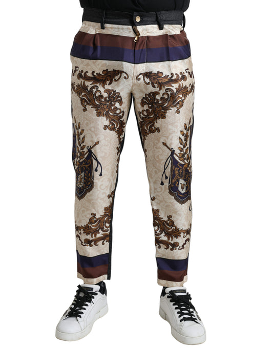 Elegantes pantalones ajustados de seda con estampado heráldico
