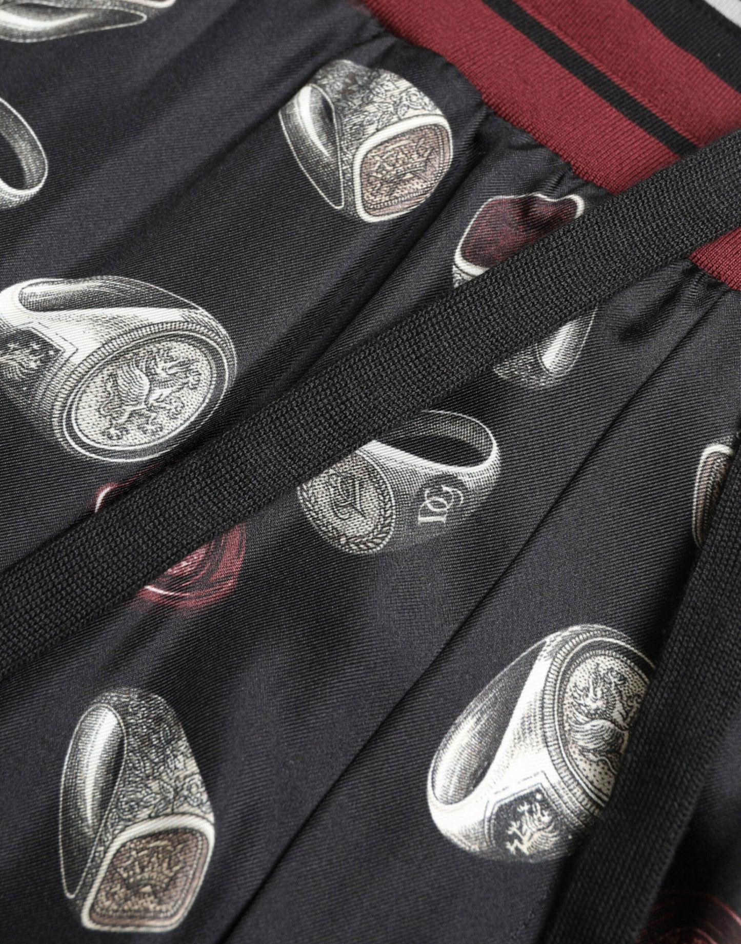Elegante pantalón de chándal de seda con estampado de anillos