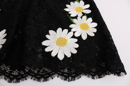 Vestido negro con encaje floral y bordado de manzanilla