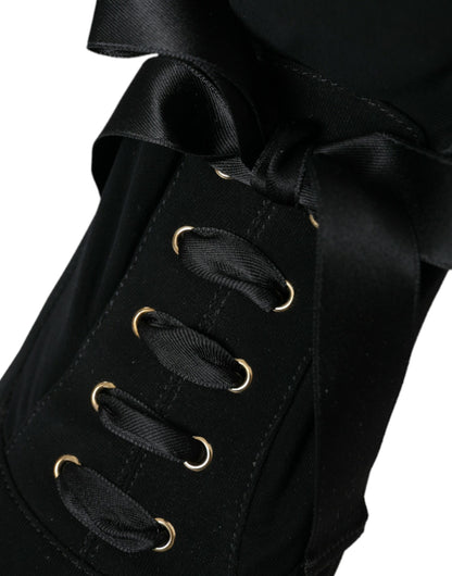 Botas negras de tacón de aguja a media pantorrilla