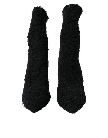 Botas negras de tacón de aguja a media pantorrilla