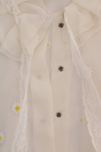 Elegante blusa de seda blanca con margaritas