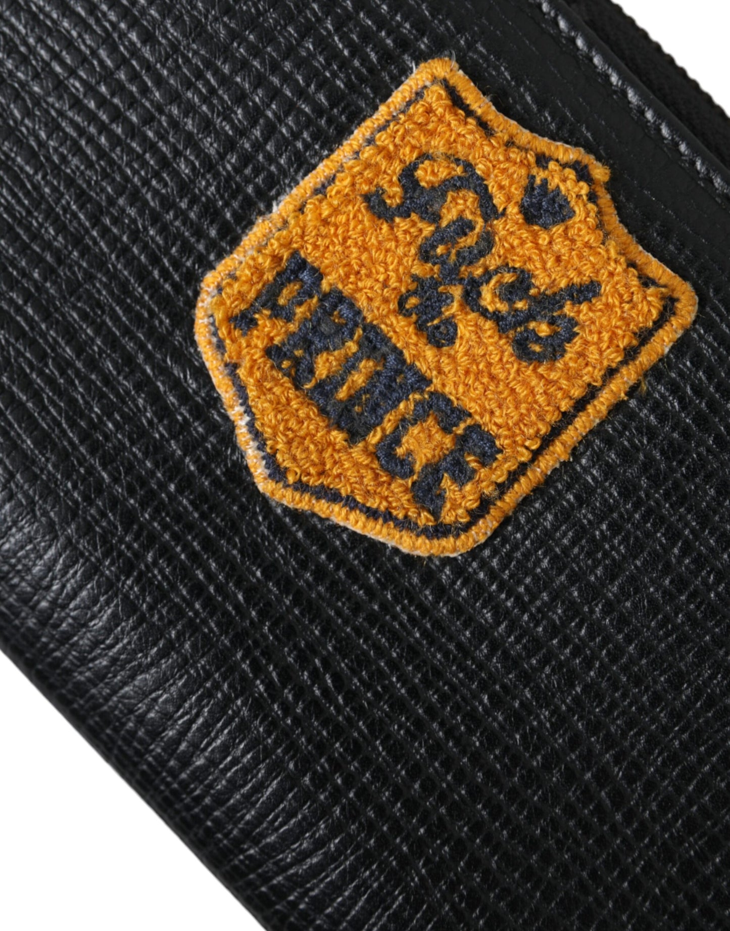 Cartera continental de cuero negro con cremallera y parche del logotipo