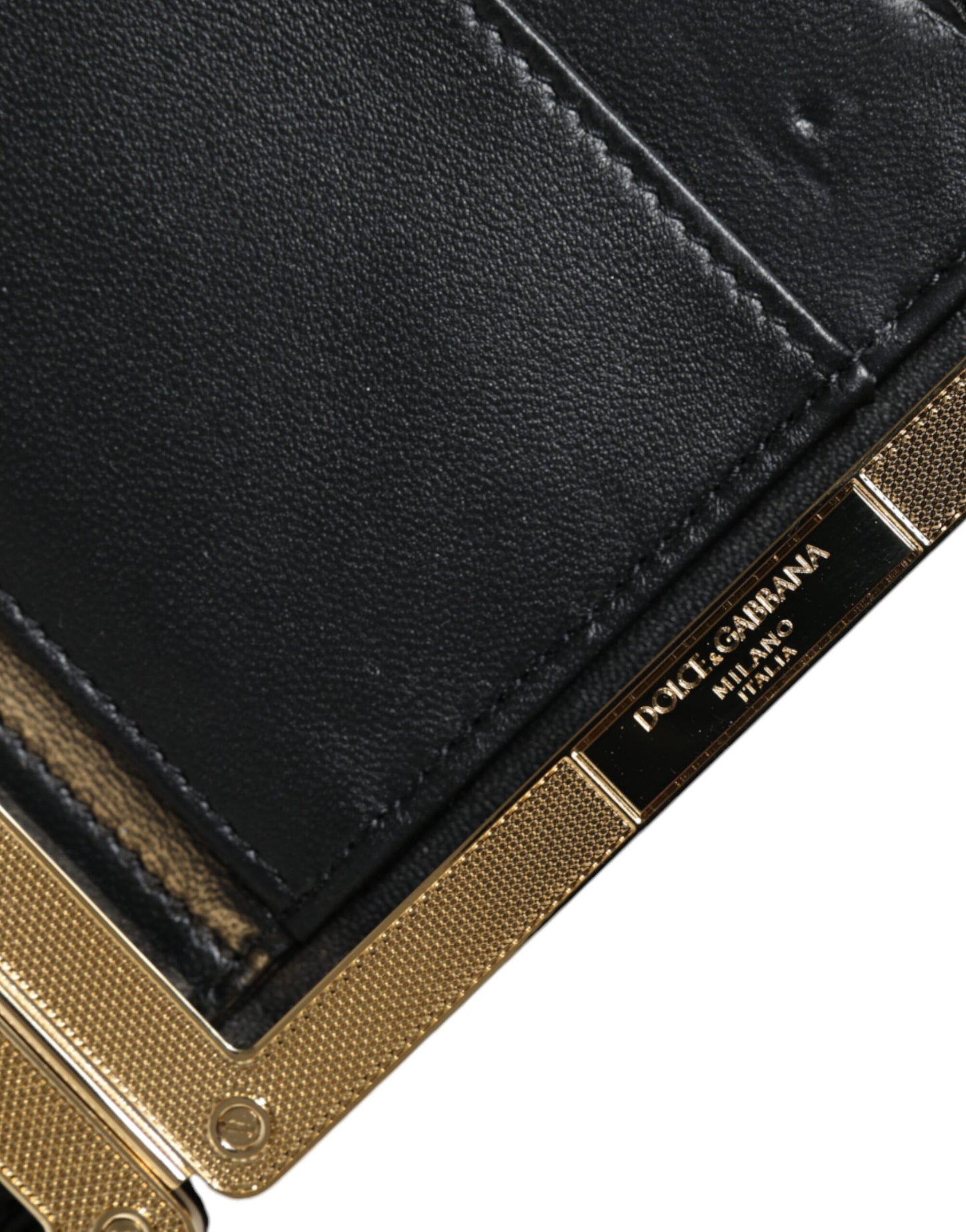 Bolso de noche tipo clutch con marco dorado y flores multicolores
