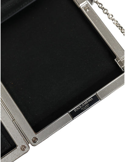 Mini bolso bandolera de cuero negro con marco plateado