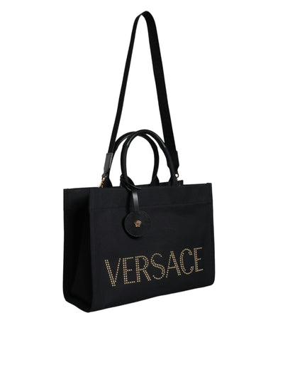 Bolso bandolera de lona negra con asa superior, de cuero y logotipo