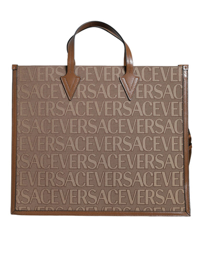 Bolso bandolera marrón con asa superior de piel jacquard y logotipo