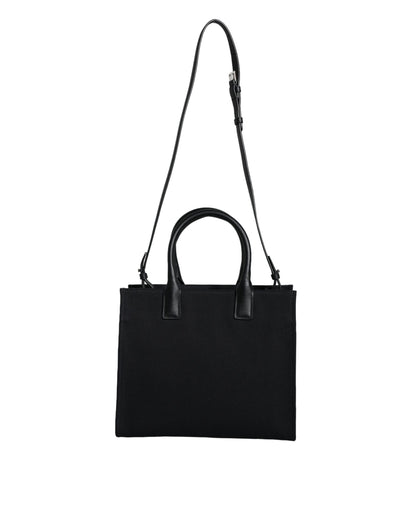 Bolso bandolera de lona negra con asa superior, de cuero y logotipo