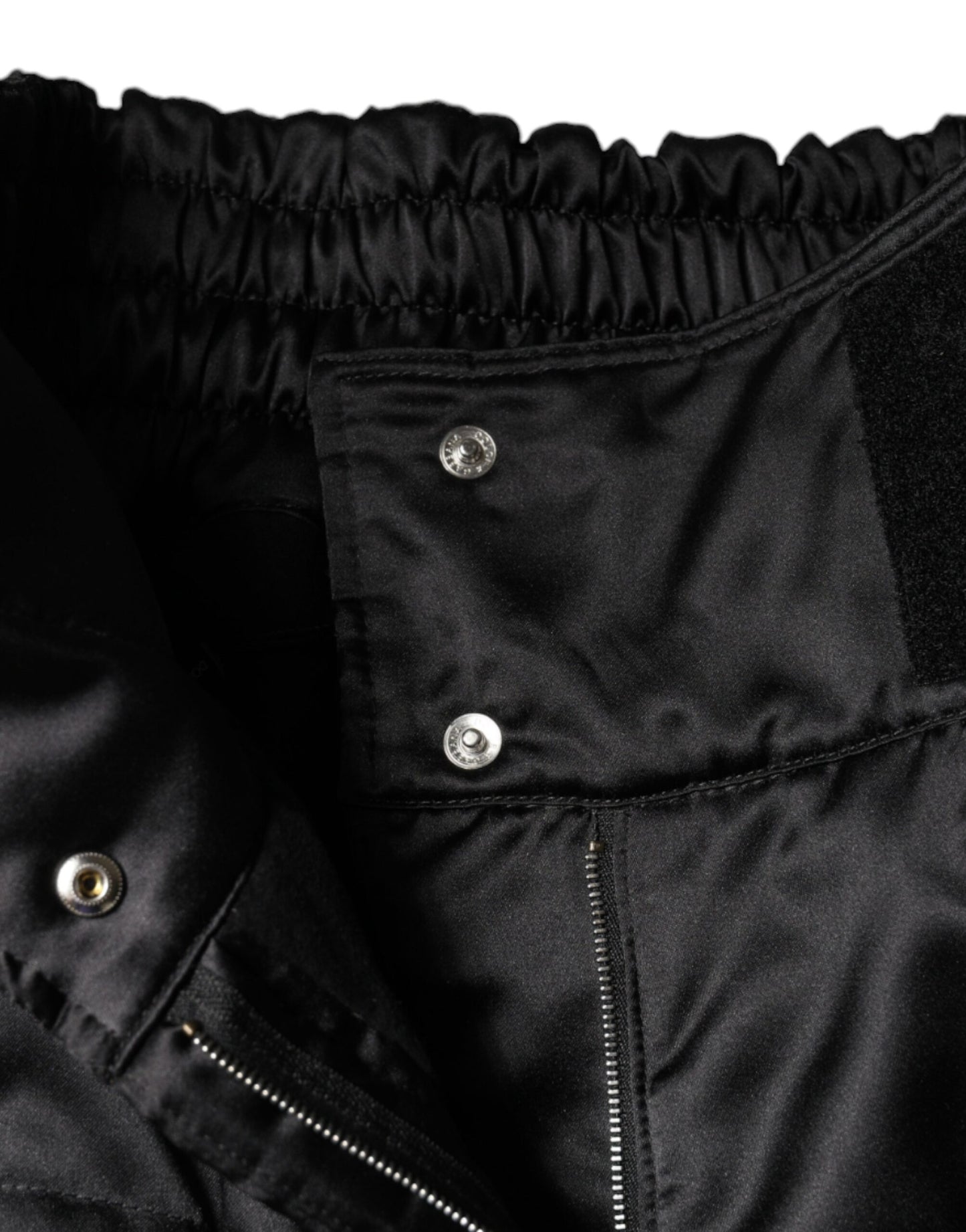 Pantalones negros acolchados de cintura alta para mujer con corte de bota