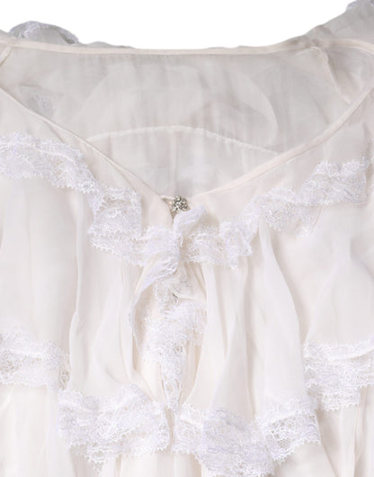 Blusa de manga larga con encaje y volantes blancos