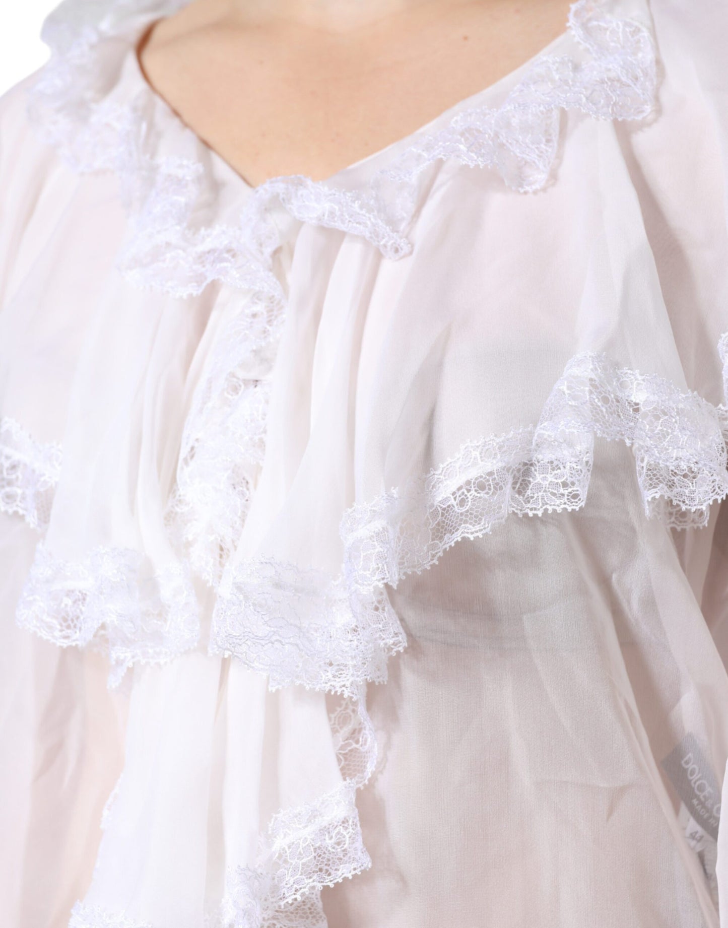 Blusa de manga larga con encaje y volantes blancos