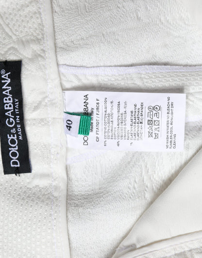 Pantalones cortos de algodón con brocado floral blanco