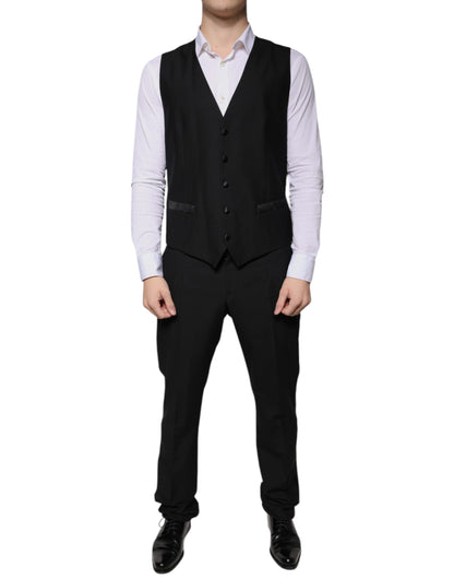 Traje formal de tres piezas de lana negra de corte entallado