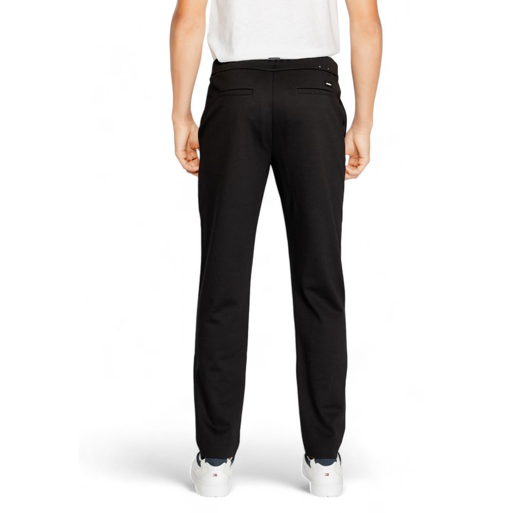 Vaqueros y pantalones de poliéster negro
