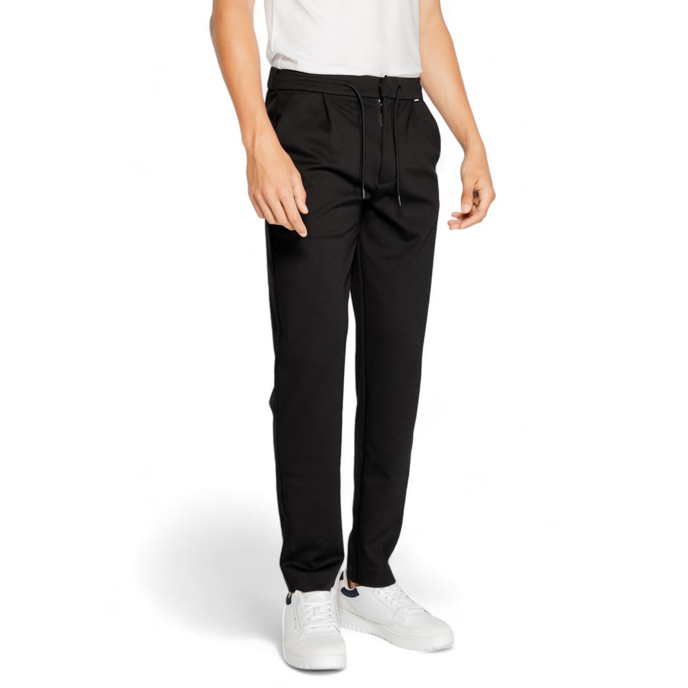 Vaqueros y pantalones de poliéster negro