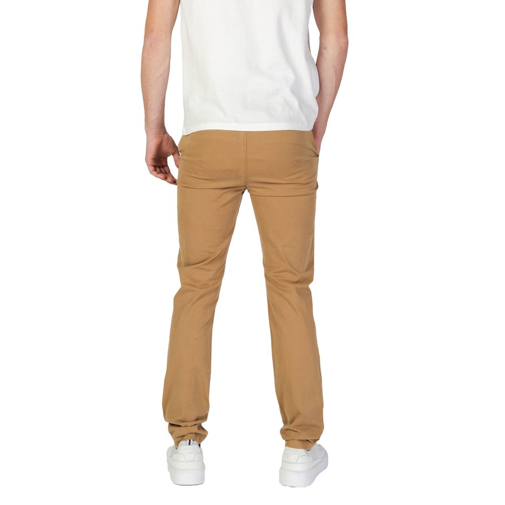 Vaqueros y pantalones de algodón beige