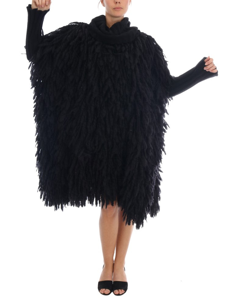 Elegante suéter negro de lana y cachemira con flecos