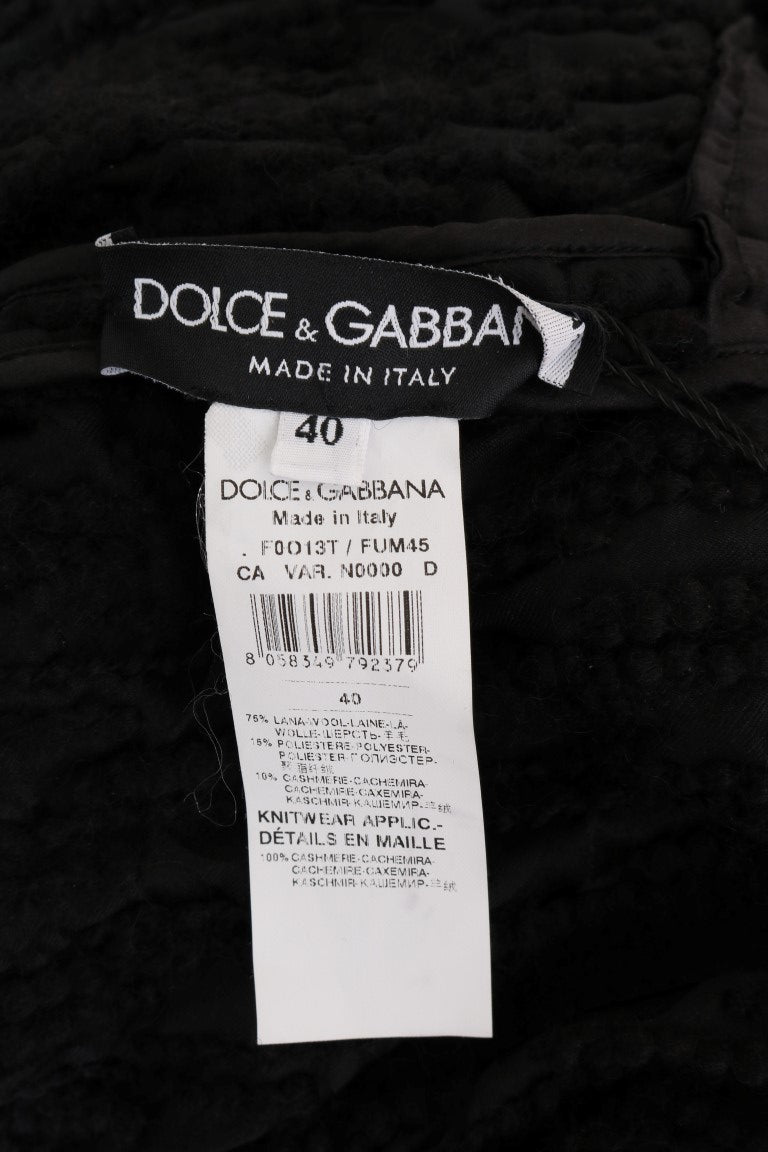 Elegante suéter negro de lana y cachemira con flecos