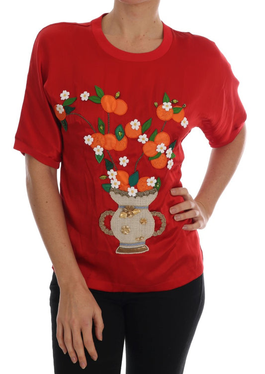Top elegante de seda roja con bordado floral