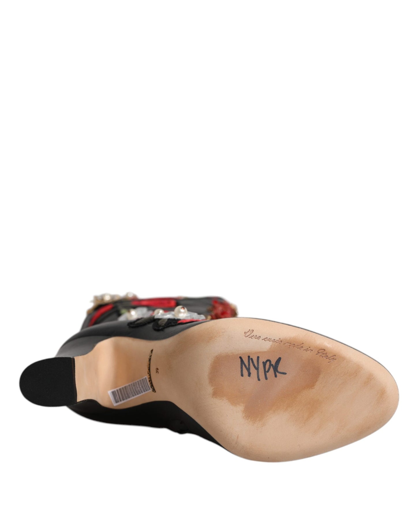 Botas de tacón de piel con adornos de rosas negras