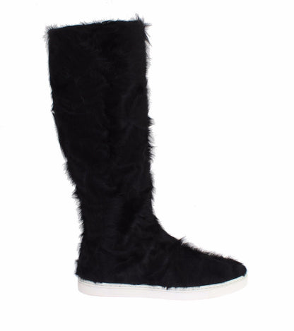 Botas planas elegantes de piel de color negro